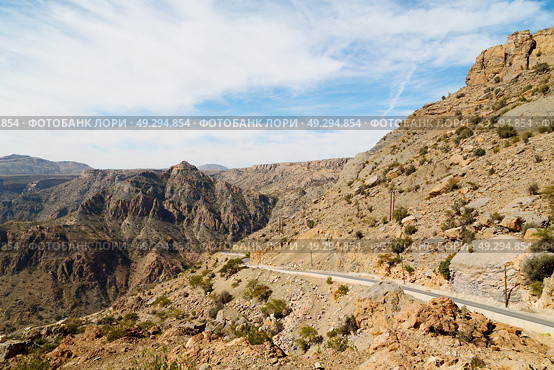  gorge and canyon the deep cloudy sky   in oman the old  mountain . Стоковое фото, агентство Ingram Publishing / Фотобанк Лори
