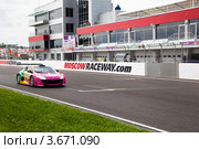 Автомобиль Megane Trophy V6 участвует в чемпионате "Мировая серия Renault" на треке "Moscow Raceway" в Подмосковье (2012 год). Редакционное фото, фотограф Николай Винокуров / Фотобанк Лори