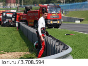 Кольцевые автогонки грузовиков Battle Truck Russia 2012: Маркус Острайх (Markus Ostreich) после аварии во второй гонке. Редакционное фото, фотограф Роман Коротков / Фотобанк Лори