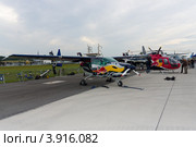 Легкий самолет Cessna 337D Skymaste и вертолет MBB Bo 105 CB (команда Red Bull). Международная авиакосмическая выставка (ILA 2012), Берлин. Германия. Редакционное фото, фотограф Sergey Kohl / Фотобанк Лори