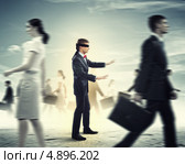 Слепой мужчина, вытянув руки, идет на ощупь среди людей. Стоковое фото, фотограф Sergey Nivens / Фотобанк Лори