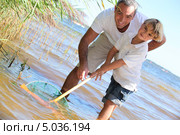 Отец с сыном на рыбалке. Стоковое фото, фотограф Phovoir Images / Фотобанк Лори