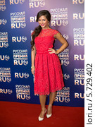 Певица Нюша в красном платье на вручении музыкальной премии Russian Music Award канала RU.TV в "Крокус Сити Холл" 25 мая 2013 года Москва, Россия. Редакционное фото, фотограф Losevsky Pavel / Фотобанк Лори