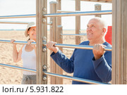 Пожилые мужчина и женщина на спортивной площадке. Стоковое фото, фотограф Яков Филимонов / Фотобанк Лори