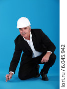 Man writing on the floor. Стоковое фото, фотограф Phovoir Images / Фотобанк Лори
