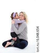 Mother holding daughter. Стоковое фото, фотограф Phovoir Images / Фотобанк Лори