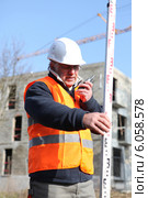 Surveyor on construction site. Стоковое фото, фотограф Phovoir Images / Фотобанк Лори