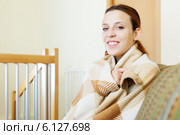 girl warming in plaid at home in winter. Стоковое фото, фотограф Яков Филимонов / Фотобанк Лори