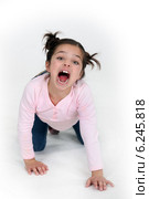 child girl on all fours is screaming. Стоковое фото, фотограф Phovoir Images / Фотобанк Лори