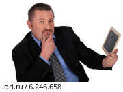 Man with a mini chalkboard. Стоковое фото, фотограф Phovoir Images / Фотобанк Лори