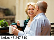 Mature couple on balcony with coffee. Стоковое фото, фотограф Яков Филимонов / Фотобанк Лори