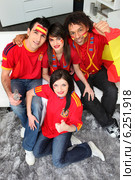 A group of friends supporting the Spanish football team. Стоковое фото, фотограф Phovoir Images / Фотобанк Лори