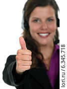 Call centre agent giving the thumb's up. Стоковое фото, фотограф Phovoir Images / Фотобанк Лори