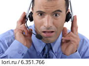 Call centre operator looking shocked. Стоковое фото, фотограф Phovoir Images / Фотобанк Лори