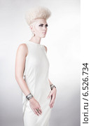 futuristic blond woman in long white dress with creative hairstyle. Стоковое фото, фотограф Александр Буц / Фотобанк Лори