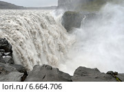 Водопад Деттифосс (исл. Dettifoss) на реке Йёкульсау-ау-Фьёдлум в дождливую погоду, Исландия (2014 год). Стоковое фото, фотограф Овчинникова Ирина / Фотобанк Лори