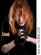 Portrait of a young woman with a flowing hair and chained arms. Стоковое фото, фотограф Art Konovalov / Фотобанк Лори