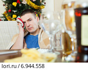 Man in scarf stuping towel to head after New Year. Стоковое фото, фотограф Яков Филимонов / Фотобанк Лори