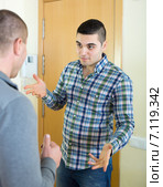 angry men looking at each other with clenching fists. Стоковое фото, фотограф Яков Филимонов / Фотобанк Лори
