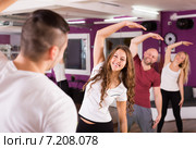 Adults limbering up in gym. Стоковое фото, фотограф Яков Филимонов / Фотобанк Лори