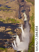 Zambia Victoria Falls on the Zambezi River between the Zambia and Zimbabwe Zambia, Zimbabwe, Victoria Falls, Zambezi, river, CWO_067Africa, Victoria Falls, on Zambezi River between Zimbabwe and Zambia. Стоковое фото, агентство BE&W Photo / Фотобанк Лори