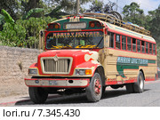 Chicken bus (Camioneta) colloquial name a colorful modified and decorated bus that transports goods and people between communities in Honduras and Guatemala.Guatemala, Antigua, typical colorful and decorated bus. Редакционное фото, агентство BE&W Photo / Фотобанк Лори