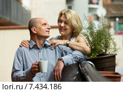 Aged couple drink tea on balcony. Стоковое фото, фотограф Яков Филимонов / Фотобанк Лори