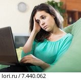 sad woman in a chair with a laptop. Стоковое фото, фотограф Яков Филимонов / Фотобанк Лори