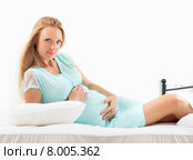 pregnant woman lying in bed at home. Стоковое фото, фотограф Яков Филимонов / Фотобанк Лори