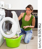 Tired woman doing laundry at home. Стоковое фото, фотограф Яков Филимонов / Фотобанк Лори