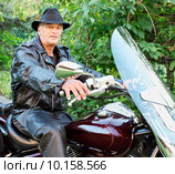 Middle-Aged Man Riding Motorcycle. Стоковое фото, фотограф Denis Pepin / PantherMedia / Фотобанк Лори