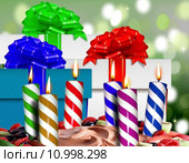 Birthday candles on a cake and gift boxes. Стоковое фото, фотограф Mohamad Razi Bin Husin / PantherMedia / Фотобанк Лори