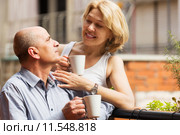 Couple drinking coffee at balcony. Стоковое фото, фотограф Яков Филимонов / Фотобанк Лори