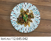 Kazan kavap - Уйгурское блюдо мясо с овощами, среднеазиатская кухня. Стоковое фото, фотограф Александр Fanfo / Фотобанк Лори