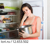 Girl holding her nose because of bad smell. Стоковое фото, фотограф Яков Филимонов / Фотобанк Лори