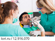 Terrified client in dental clinic. Стоковое фото, фотограф Яков Филимонов / Фотобанк Лори