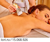 Young man receiving electric facial massage. Стоковое фото, фотограф Gennadiy Poznyakov / Фотобанк Лори