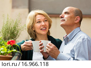 Aged couple drink tea on balcony. Стоковое фото, фотограф Яков Филимонов / Фотобанк Лори