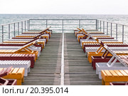 deck chairs on the pier in the sea. Стоковое фото, фотограф Losevsky Pavel / Фотобанк Лори