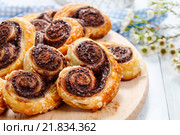 Palmier biscuits - french cookies made of puff pastry and chocolate. Стоковое фото, агентство BE&W Photo / Фотобанк Лори