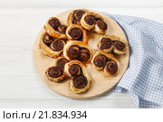 Palmier biscuits - french cookies made of puff pastry and chocolate. Стоковое фото, агентство BE&W Photo / Фотобанк Лори