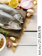 Two rainbow trouts on rustic wooden table, copy space. Стоковое фото, агентство BE&W Photo / Фотобанк Лори