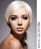 Fashion portrait of young woman with blond hairs and black makeup of eye. Стоковое фото, фотограф Валуа Виталий / Фотобанк Лори