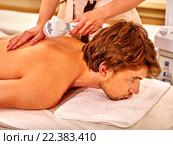 Young man receiving electric facial massage. Стоковое фото, фотограф Gennadiy Poznyakov / Фотобанк Лори