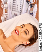 Young woman is going to do an electric facial massage. Стоковое фото, фотограф Gennadiy Poznyakov / Фотобанк Лори