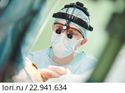 male cardiac surgeon at child cardiosurgery operating room. Стоковое фото, фотограф Дмитрий Калиновский / Фотобанк Лори