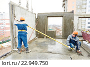 Construction worker. Builders concreter joiners at work. Стоковое фото, фотограф Дмитрий Калиновский / Фотобанк Лори