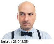 Скептический серьёзный лысый мужчина, изолированно на белом фоне. Стоковое фото, фотограф Александр Лычагин / Фотобанк Лори