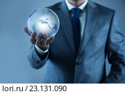 Businessman holding earth in global concept. Стоковое фото, фотограф Elnur / Фотобанк Лори