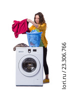 Woman tired after doing laundry isolated on white. Стоковое фото, фотограф Elnur / Фотобанк Лори